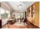 Spacious living room with built-in shelving, large windows, ceiling fan, and neutral toned decor at 1567 S Western Skies Dr, Gilbert, AZ 85296