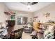 Inviting office space with built-in shelving and comfortable seating area at 1567 S Western Skies Dr, Gilbert, AZ 85296