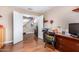 Home office leading to a hallway, featuring a desk and chair setup perfect for working at 1567 S Western Skies Dr, Gilbert, AZ 85296