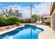Sparkling blue pool and spa surrounded by lush landscaping, perfect for outdoor enjoyment at 1567 S Western Skies Dr, Gilbert, AZ 85296