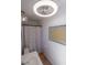 Bathroom features a sink, toilet, unique ceiling fan and tub with a shower curtain at 16446 N 59Th St, Scottsdale, AZ 85254