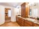 Bathroom features double sinks with granite countertops and a walk-in shower at 16446 N 59Th St, Scottsdale, AZ 85254