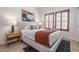 Inviting bedroom with stylish decor, art, and shuttered windows at 16446 N 59Th St, Scottsdale, AZ 85254