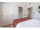 Bright bedroom features white walls, a closet, and a comfortable bed with stylish, modern decor at 16446 N 59Th St, Scottsdale, AZ 85254