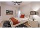 Inviting bedroom with stylish decor, art, and a view of the backyard at 16446 N 59Th St, Scottsdale, AZ 85254