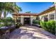 Outdoor living space in a private courtyard, with a view to the interior through French doors at 16446 N 59Th St, Scottsdale, AZ 85254