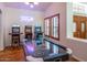 Fun game room featuring an air hockey table, vintage arcade games, and shuttered windows at 16446 N 59Th St, Scottsdale, AZ 85254