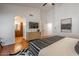 Spacious main bedroom with hardwood floors and ensuite bathroom entrance at 16446 N 59Th St, Scottsdale, AZ 85254