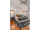 Bright main bedroom features wooden floors, shuttered windows, and stylish décor at 16446 N 59Th St, Scottsdale, AZ 85254