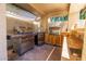 Outdoor kitchen equipped with stainless steel appliances and ample counter space, ideal for outdoor dining and entertaining at 16446 N 59Th St, Scottsdale, AZ 85254
