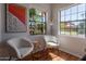 Cozy sitting area with comfortable chairs and large windows providing natural light and neighborhood views at 16446 N 59Th St, Scottsdale, AZ 85254
