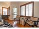 Sitting room features two chairs and light from shuttered windows at 16446 N 59Th St, Scottsdale, AZ 85254