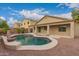 An inviting backyard featuring a pool, patio area, and lush palm trees, perfect for outdoor enjoyment at 19008 N Lousandra Dr, Maricopa, AZ 85138