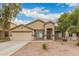Charming single-story home with a two-car garage and neutral-toned facade at 19008 N Lousandra Dr, Maricopa, AZ 85138