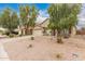 Attractive single-story home featuring desert landscaping and an attached two-car garage at 19008 N Lousandra Dr, Maricopa, AZ 85138