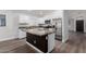 Beautiful kitchen features white cabinets, granite countertops, island, and stainless steel appliances at 19008 N Lousandra Dr, Maricopa, AZ 85138