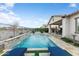 Beautiful backyard with a pool, outdoor kitchen, covered patio, and desert views, perfect for entertaining at 20528 W Coolidge St, Buckeye, AZ 85396