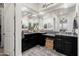 This bathroom features dual sinks with granite countertops and lots of mirror space at 20528 W Coolidge St, Buckeye, AZ 85396