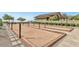 Outdoor bocce ball court nestled among mature landscaping and hardscape at 20528 W Coolidge St, Buckeye, AZ 85396