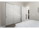 Bedroom featuring a closet with sliding doors that leads to the laundry room at 20528 W Coolidge St, Buckeye, AZ 85396