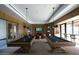 Beautifully designed game room with two pool tables and multiple TV screens at 20528 W Coolidge St, Buckeye, AZ 85396