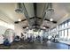 Well-lit gym featuring modern exercise equipment, high ceilings, and a spacious layout at 20528 W Coolidge St, Buckeye, AZ 85396