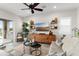 Inviting living room with modern decor, a large TV, and seamless access to the outdoor patio at 20528 W Coolidge St, Buckeye, AZ 85396