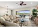 Cozy living room with a large sectional sofa and views of the outdoor pool area at 20528 W Coolidge St, Buckeye, AZ 85396