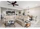 Spacious living room with a kitchen, dining space, and comfortable seating at 20528 W Coolidge St, Buckeye, AZ 85396