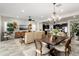 Open-concept living space with a kitchen, dining area, and living room, perfect for modern living and entertaining at 20528 W Coolidge St, Buckeye, AZ 85396