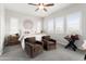 Serene main bedroom with three windows, neutral colors, and cozy seating area at 20528 W Coolidge St, Buckeye, AZ 85396