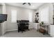 This office features plantation shutters, built in storage, and a desk with multiple computer monitors at 20528 W Coolidge St, Buckeye, AZ 85396