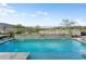 Beautiful pool with rock wall and golf course view at 20528 W Coolidge St, Buckeye, AZ 85396