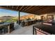 Expansive patio with seating, offering views of the golf course and mountains at 20528 W Coolidge St, Buckeye, AZ 85396