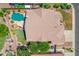 Overhead view of house featuring pool, patio, and yard with mature trees at 2068 S Sailors Ct, Gilbert, AZ 85295