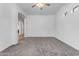 Bright bedroom with carpet, ceiling fan and open view to hall at 2068 S Sailors Ct, Gilbert, AZ 85295