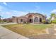 Charming single-story home with manicured lawn, mature plants and a three-car garage at 2068 S Sailors Ct, Gilbert, AZ 85295
