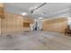 Garage featuring storage cabinets, overhead lighting, and two car garage door at 2068 S Sailors Ct, Gilbert, AZ 85295
