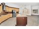 A spacious kitchen features an island and stainless steel appliances with ample natural light at 2068 S Sailors Ct, Gilbert, AZ 85295