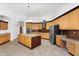 A well-appointed kitchen with an island, built-in desk, and stainless appliances at 2068 S Sailors Ct, Gilbert, AZ 85295