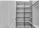 Walk-in closet with custom storage solutions and shelving system at 2068 S Sailors Ct, Gilbert, AZ 85295