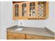A conveniently located wet bar area includes a sink, cabinets, and wine rack at 2068 S Sailors Ct, Gilbert, AZ 85295