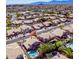 Scenic aerial view of a desert neighborhood featuring lush greenery, mature landscaping, tile roofs, and backyard swimming pools at 2108 E Tecoma Rd, Phoenix, AZ 85048