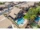 Aerial view of a private backyard oasis with pool, spa, patio, and lush landscaping at 2108 E Tecoma Rd, Phoenix, AZ 85048