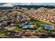 Gorgeous community view showcasing lush green spaces, pool, tennis courts, and mountain views at 2108 E Tecoma Rd, Phoenix, AZ 85048