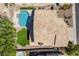 Aerial view showcasing a private backyard oasis with a pool, lush greenery, and a well-maintained tile roof at 2108 E Tecoma Rd, Phoenix, AZ 85048