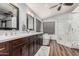 Bathroom with double sinks, a glass enclosed shower and free standing tub at 2108 E Tecoma Rd, Phoenix, AZ 85048