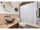 Stylish bathroom featuring a vessel sink on granite countertop and tiled walls at 2108 E Tecoma Rd, Phoenix, AZ 85048