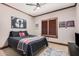 Bedroom with wood trim, sports decor, and plantation shutters at 2108 E Tecoma Rd, Phoenix, AZ 85048