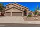 Charming home with a tile roof, desert landscaping, and a three-car garage at 2108 E Tecoma Rd, Phoenix, AZ 85048